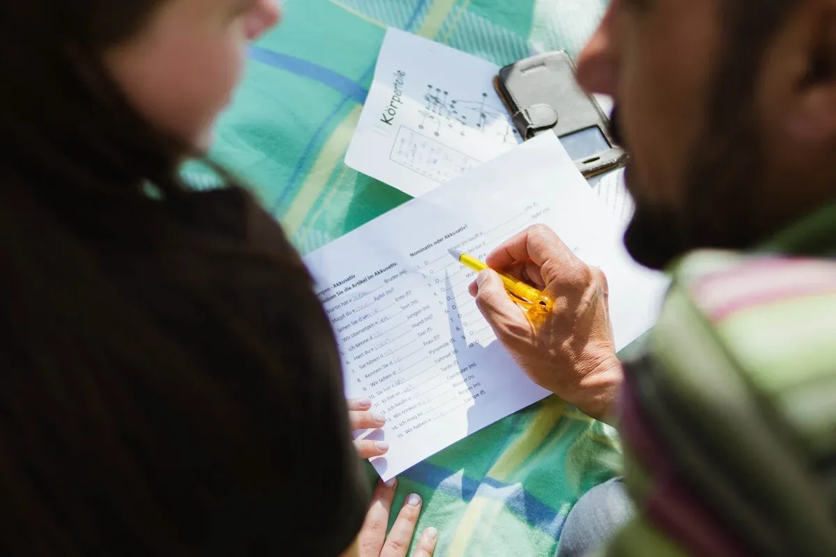 Two people doing a language course