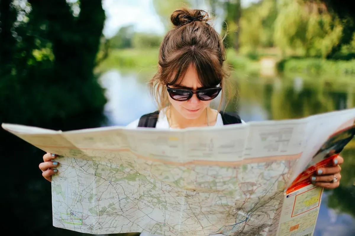 A woman looking at a map for orientation